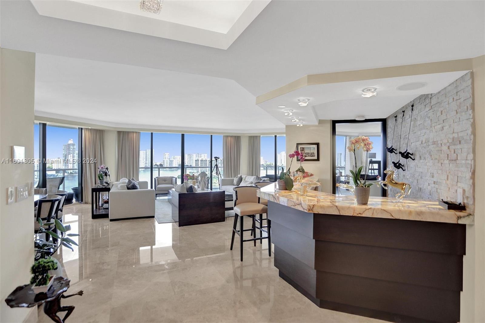 a view of living room filled with furniture and window