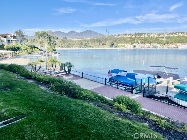 a view of a lake with outdoor seating