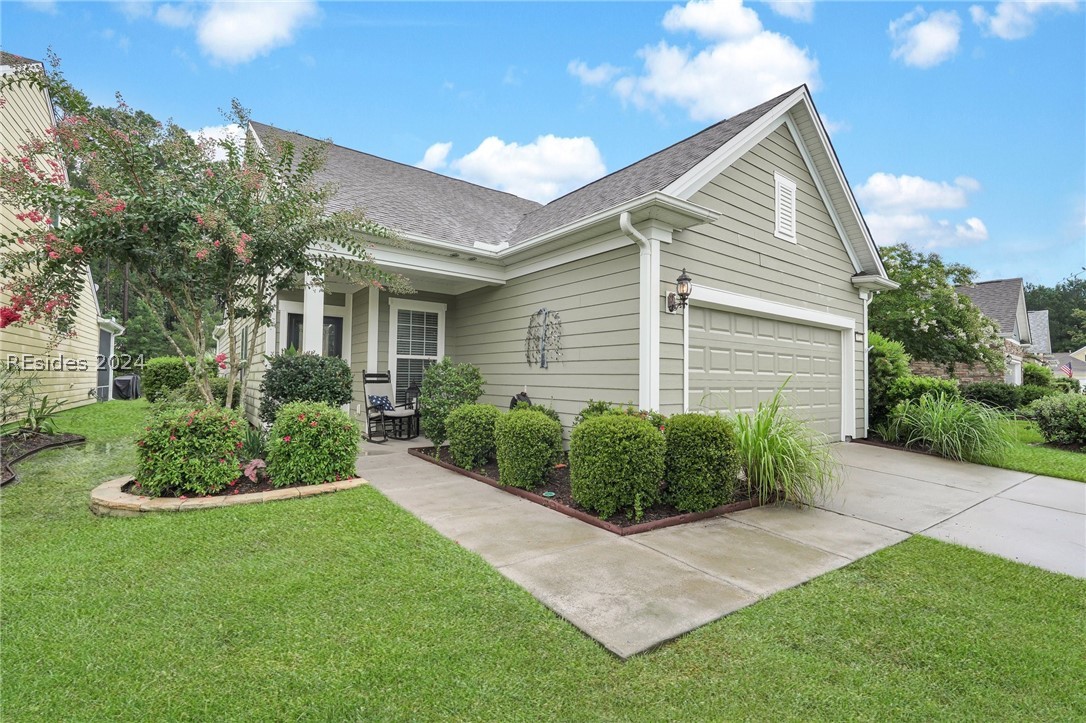 Lush landscaping leading to the front foor