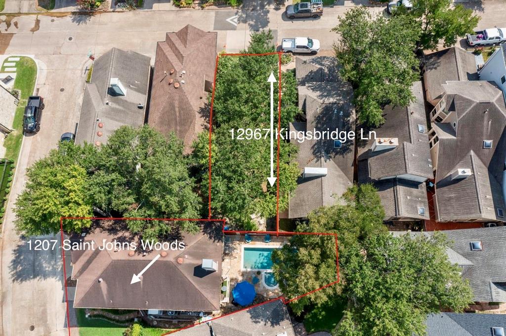 an aerial view of multiple houses with yard