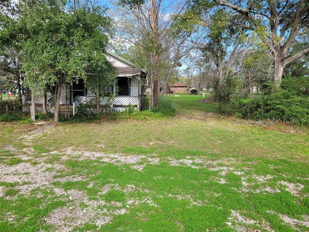 a view of a house with backyard porch and sitting area