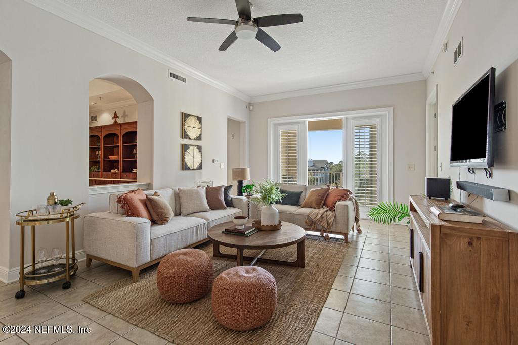 a living room with fireplace furniture and a flat screen tv