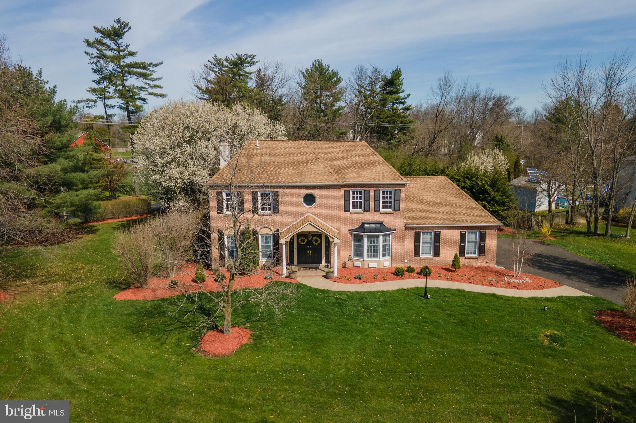 a front view of a house with a big yard