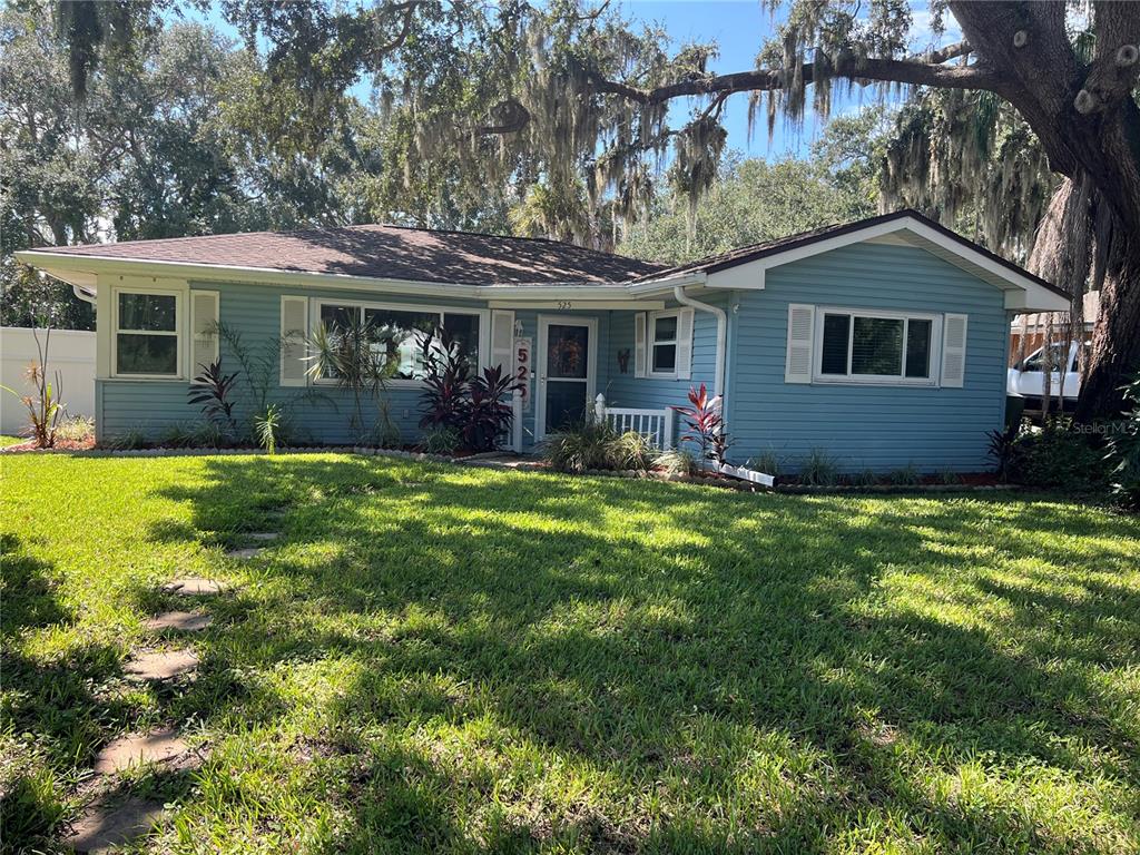 front view of a house with a yard