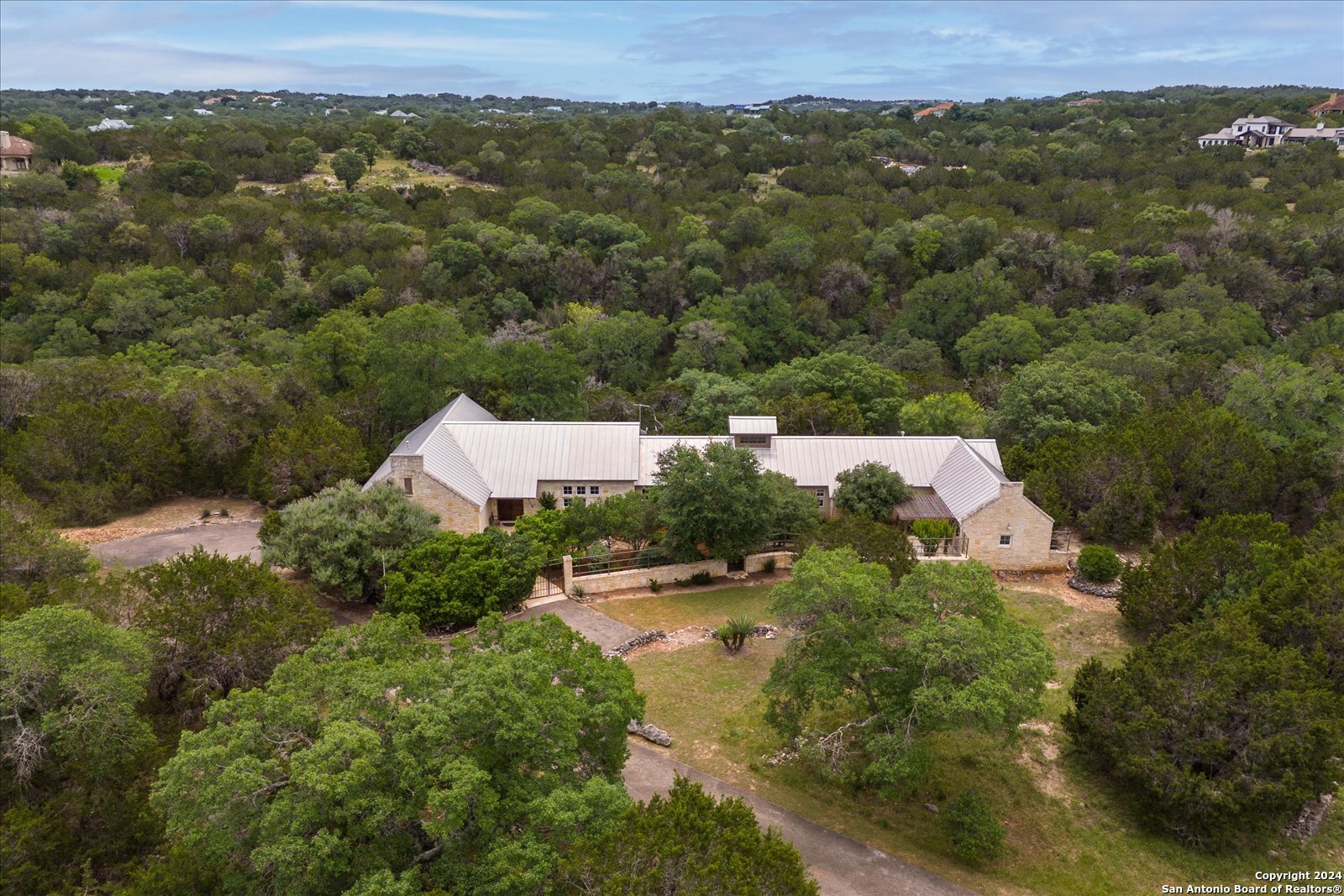 an aerial view of a house with a garden