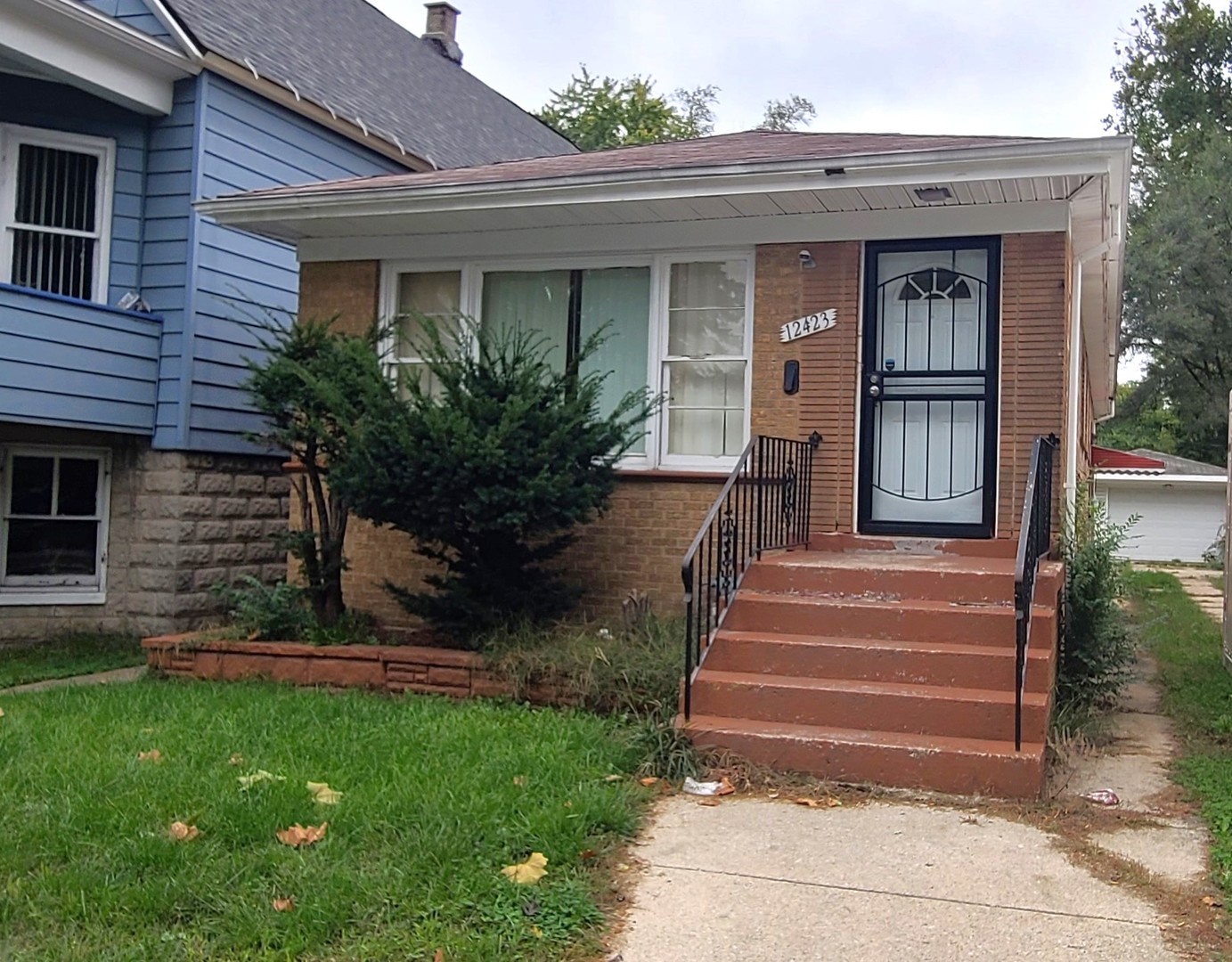 a front view of a house with garden