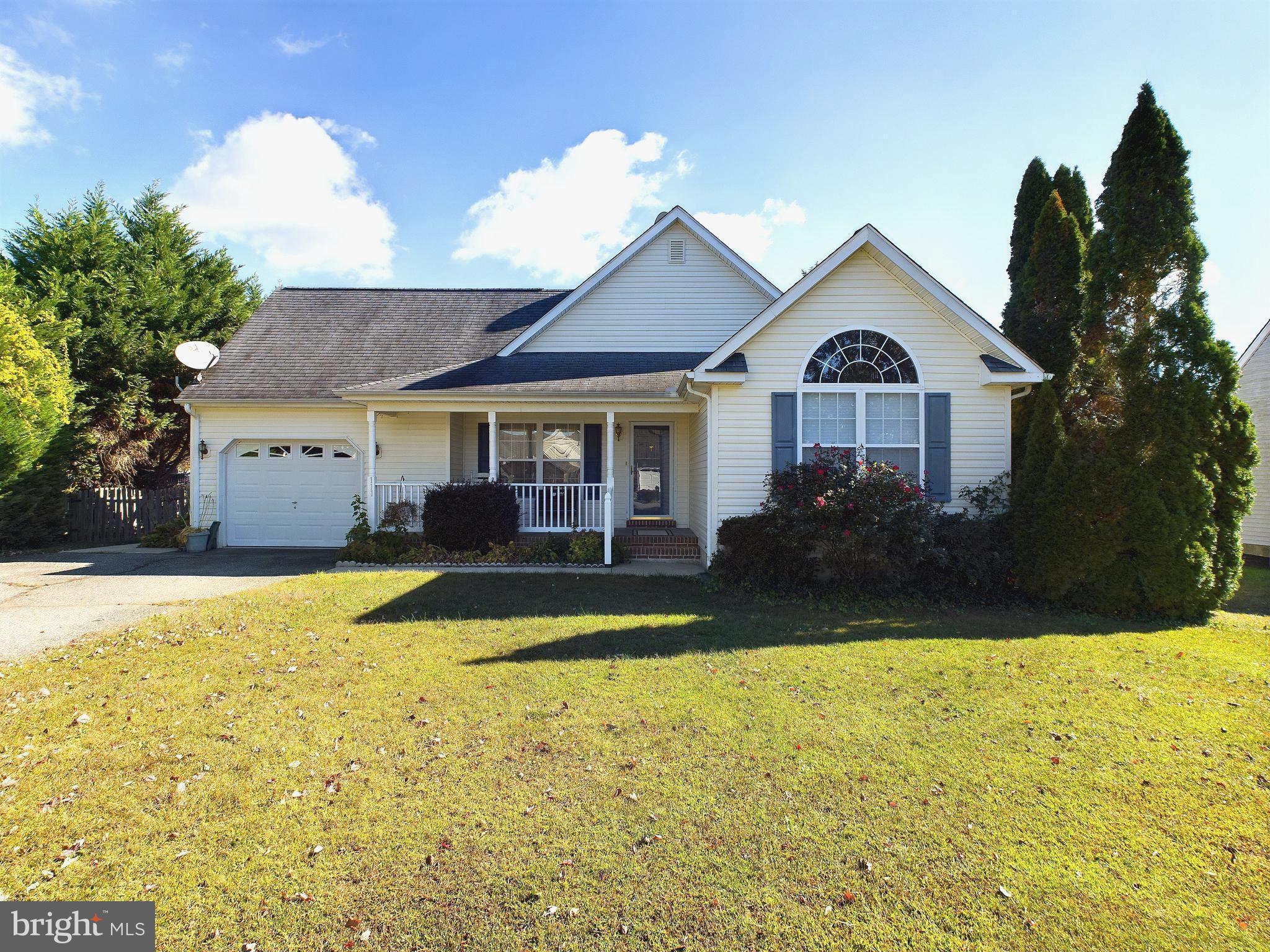 a view of house that has a large pool with a yard