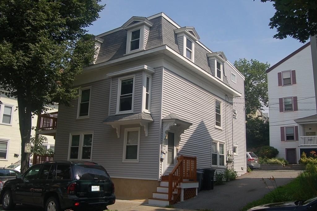 a view of a house with a street