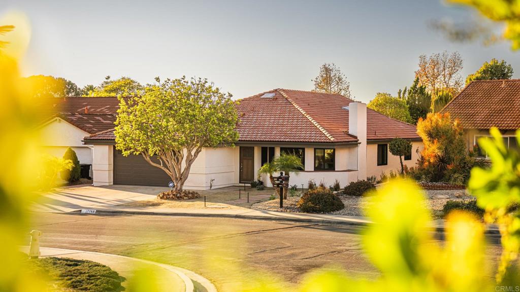 a front view of house with yard and swimming pool