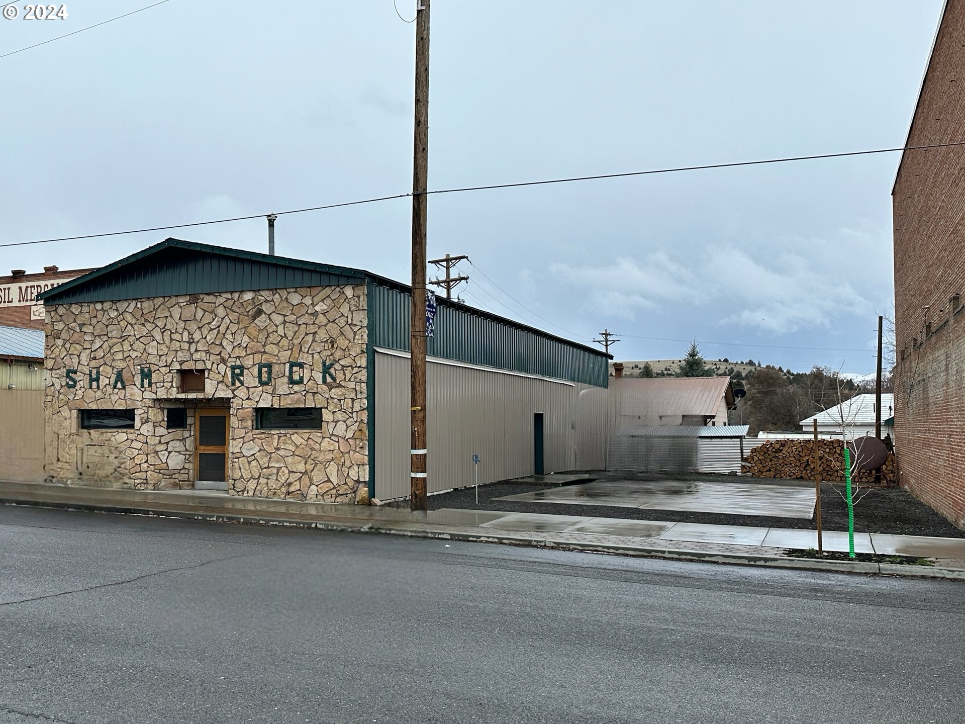 a view of a street with a building in the background