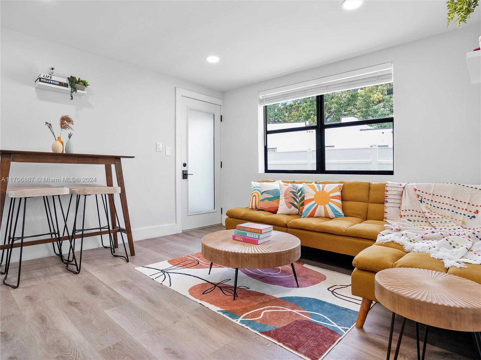 a living room with furniture and a window