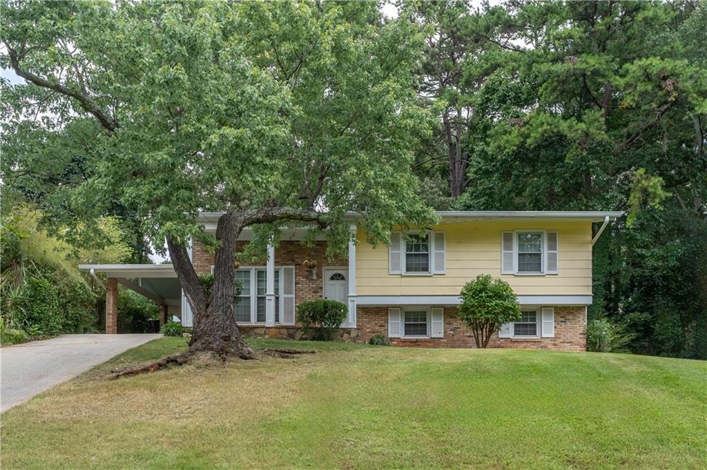 front view of a house with a garden