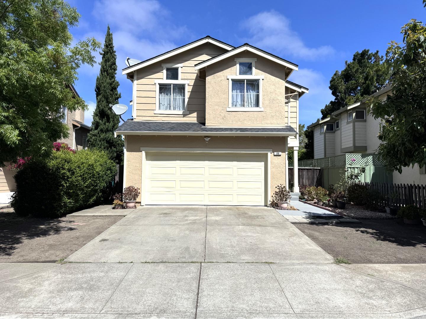 a front view of a house with a garage