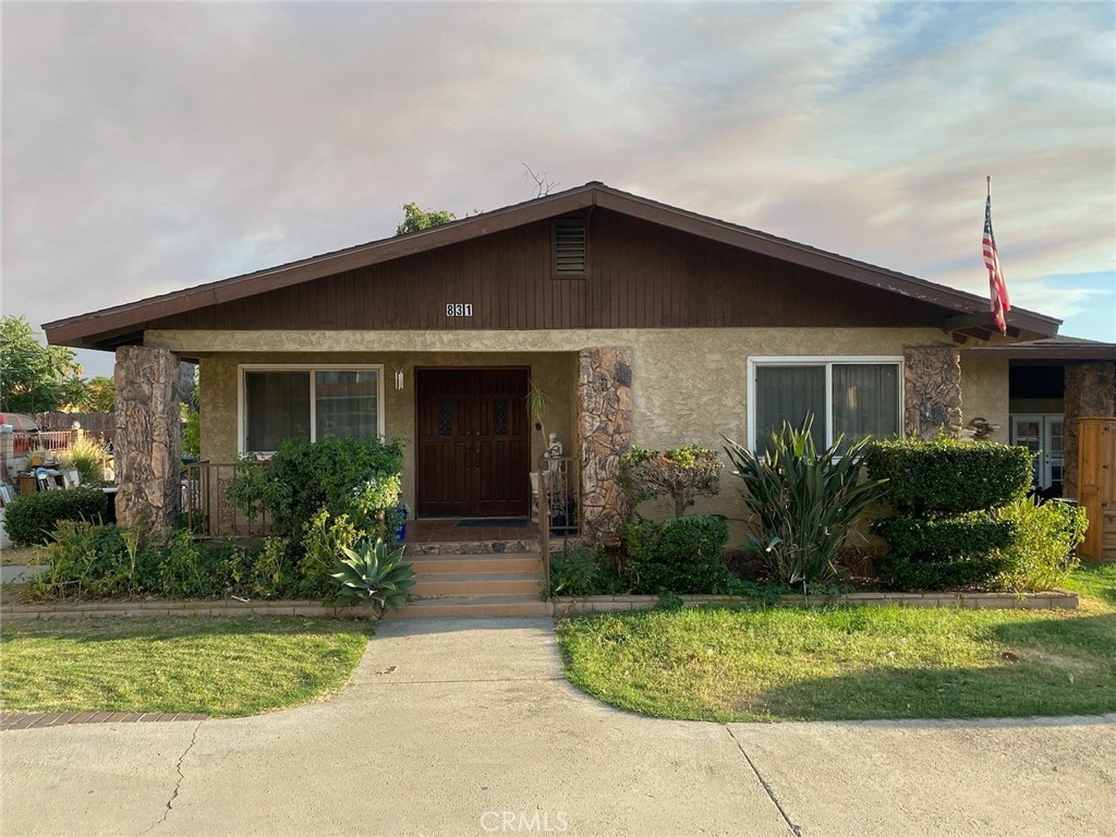 a front view of a house with garden