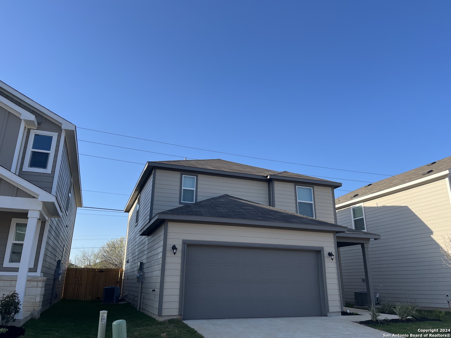 a front view of a house with a garage