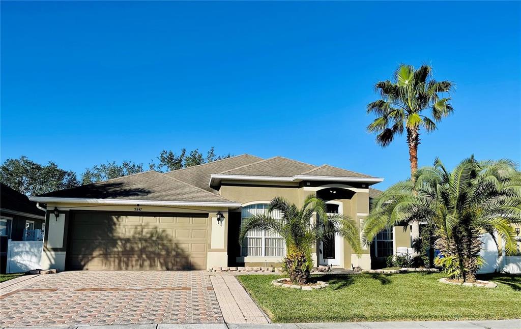 a view of a house with a yard