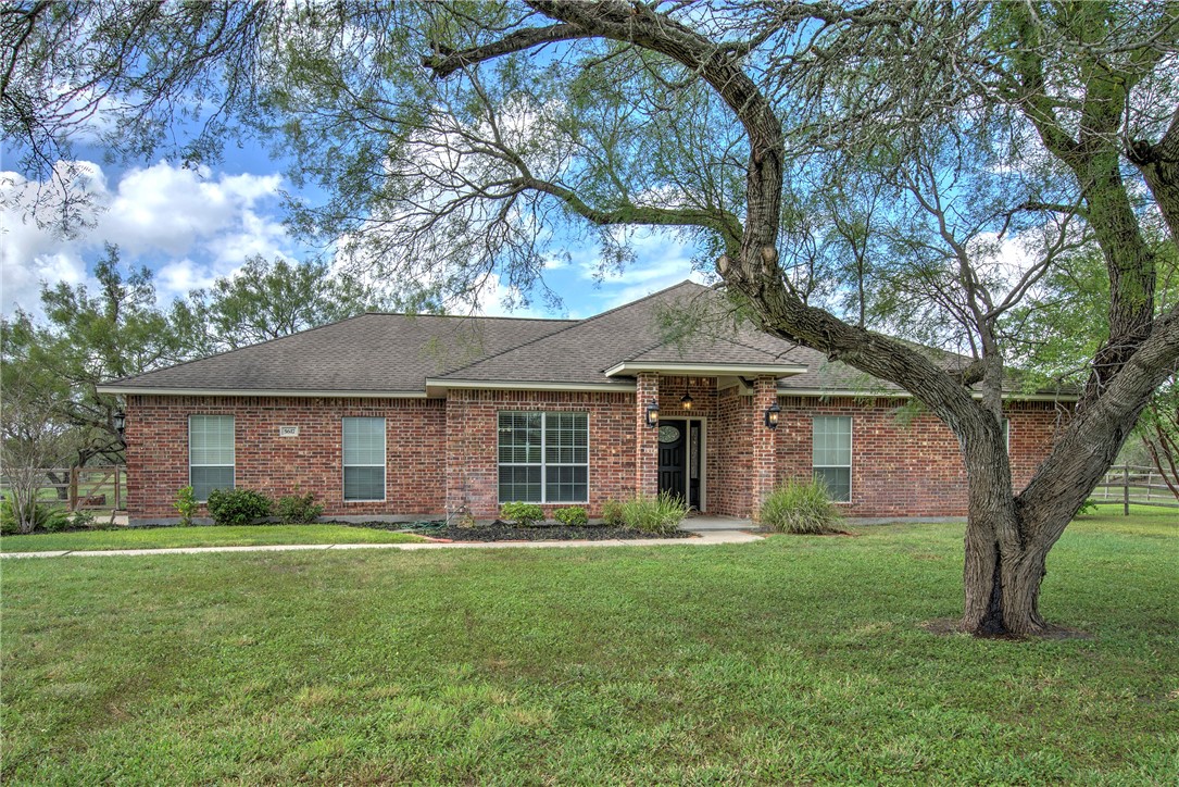 front view of a house with a yard