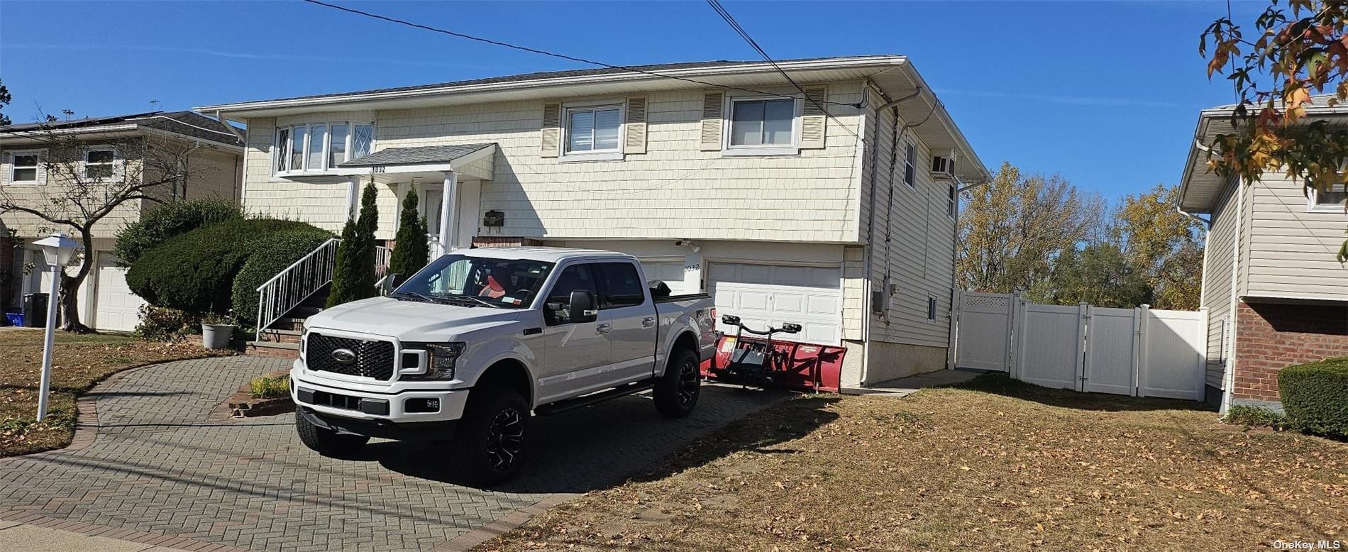 a view of a car park in front of house