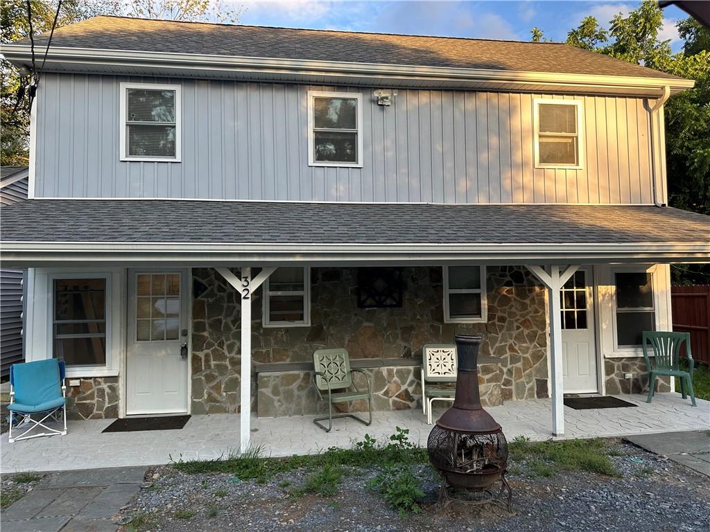 a front view of a house with patio