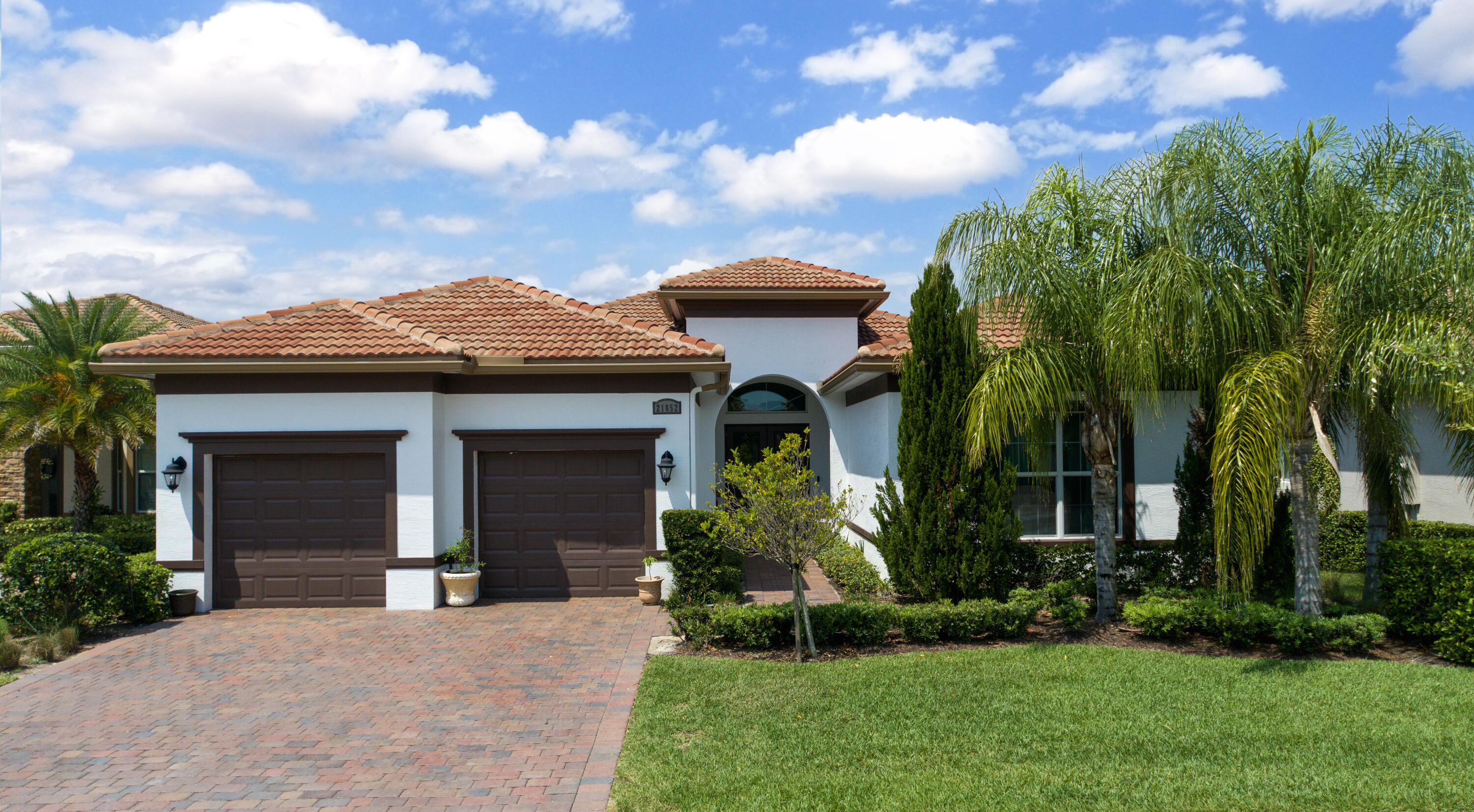 front view of a house with a yard