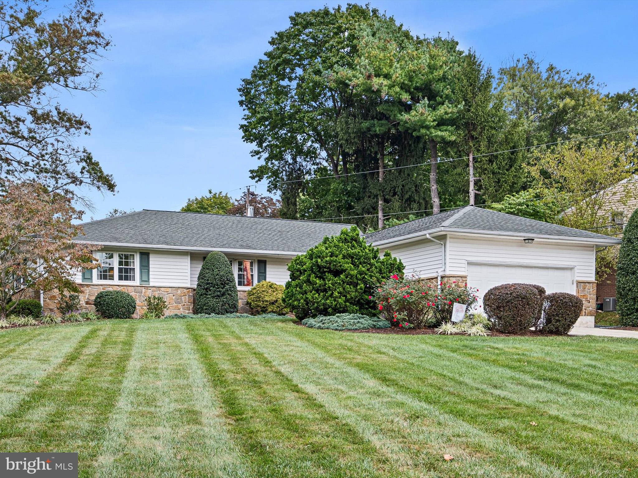 a view of house with yard