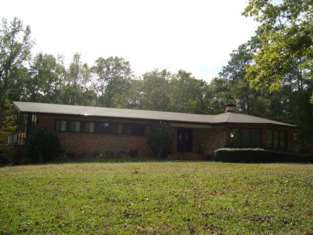 a front view of house with a yard