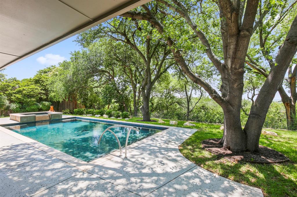 a view of a swimming pool with a patio