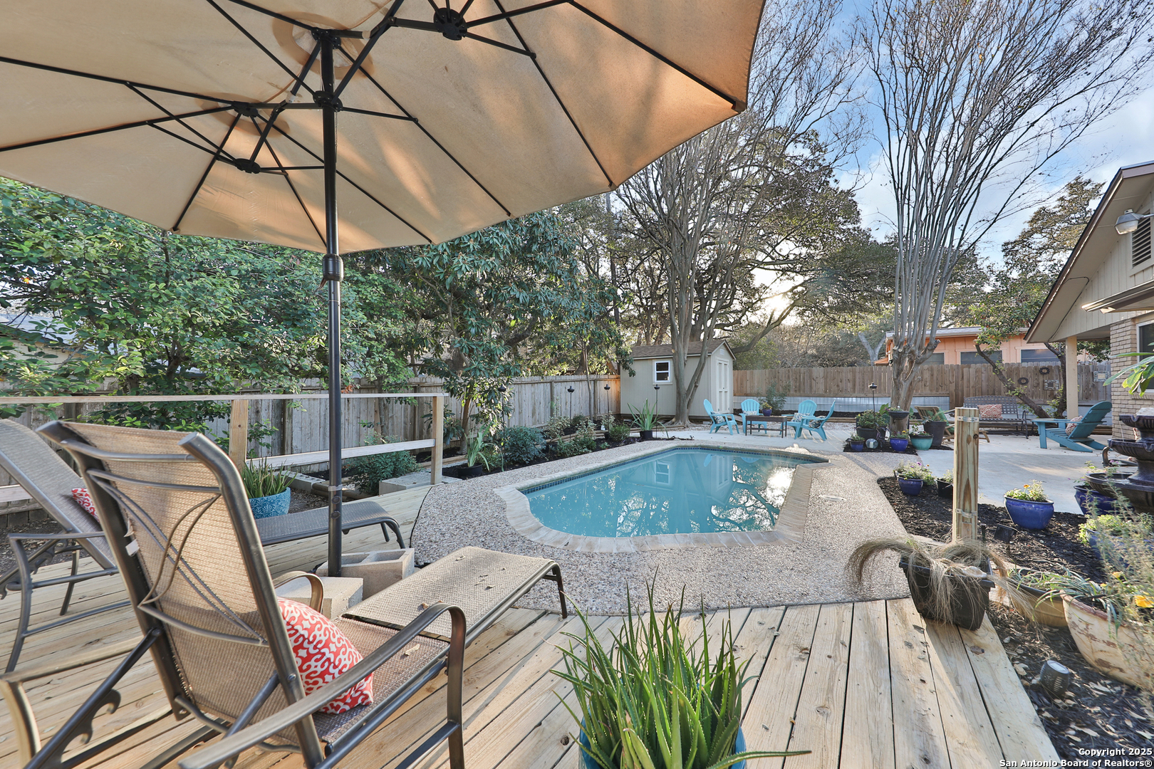 a view of a swimming pool with a patio