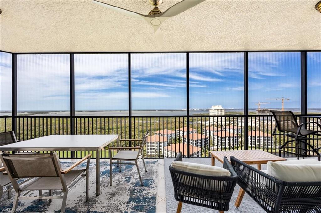 a view of a balcony with chairs