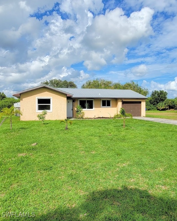 a view of house with backyard