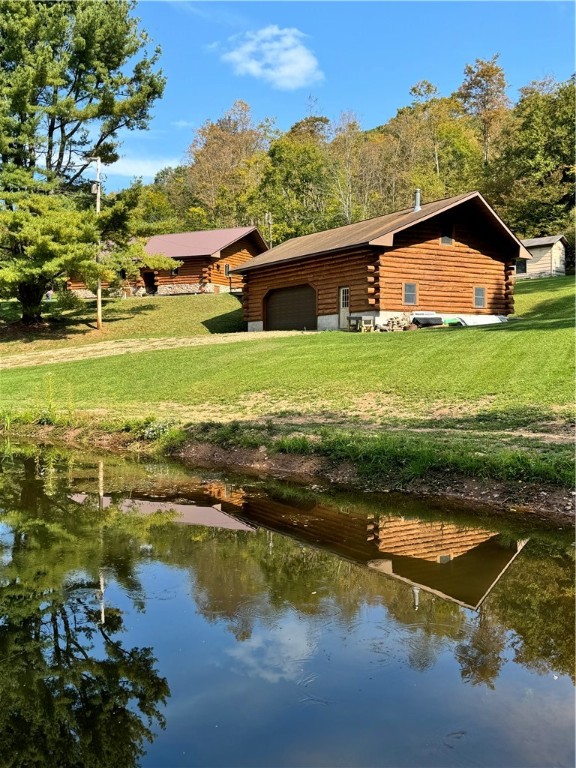 Log home, garage, pond and acreage