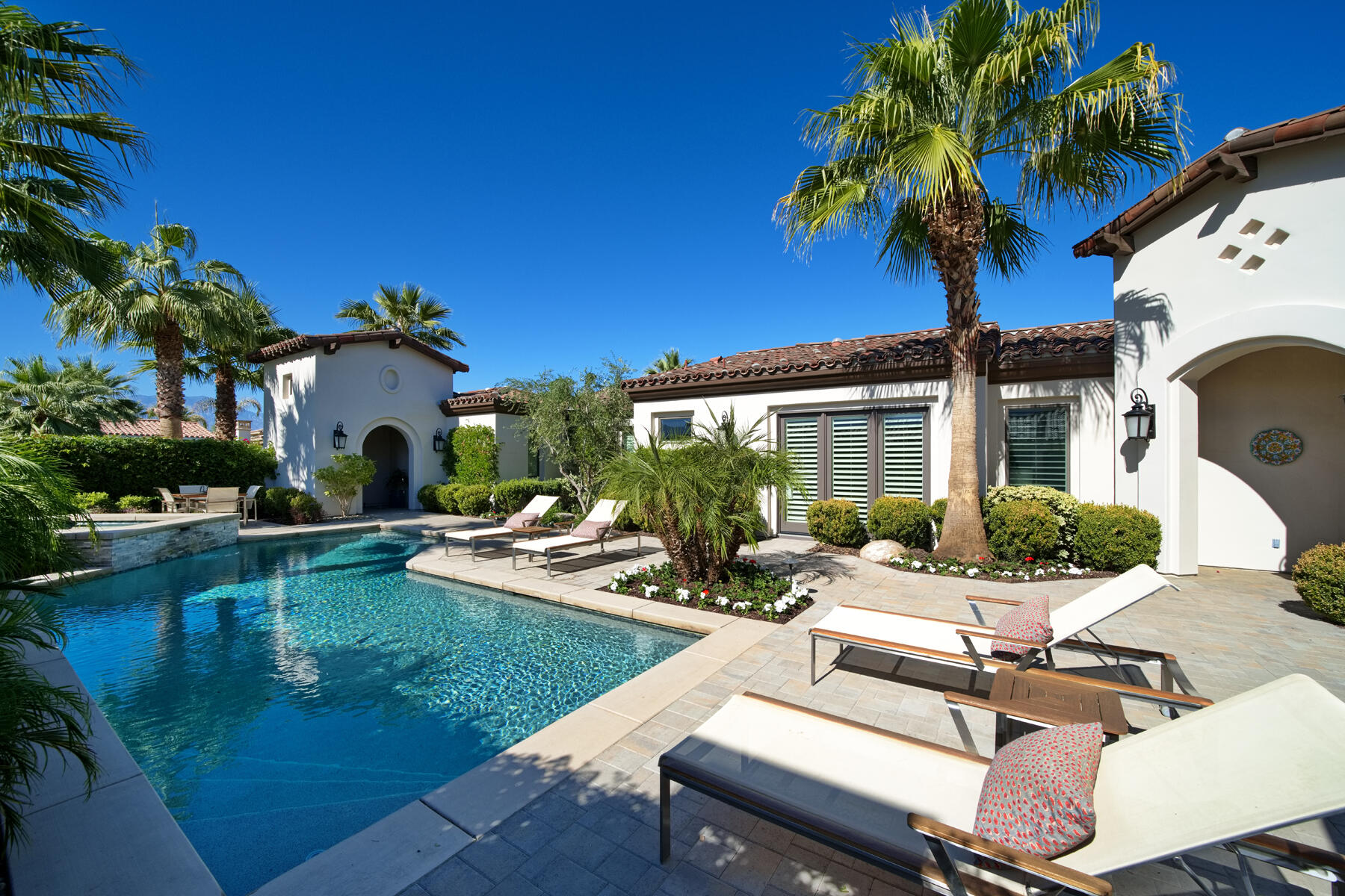 a view of a patio with swimming pool table and chairs