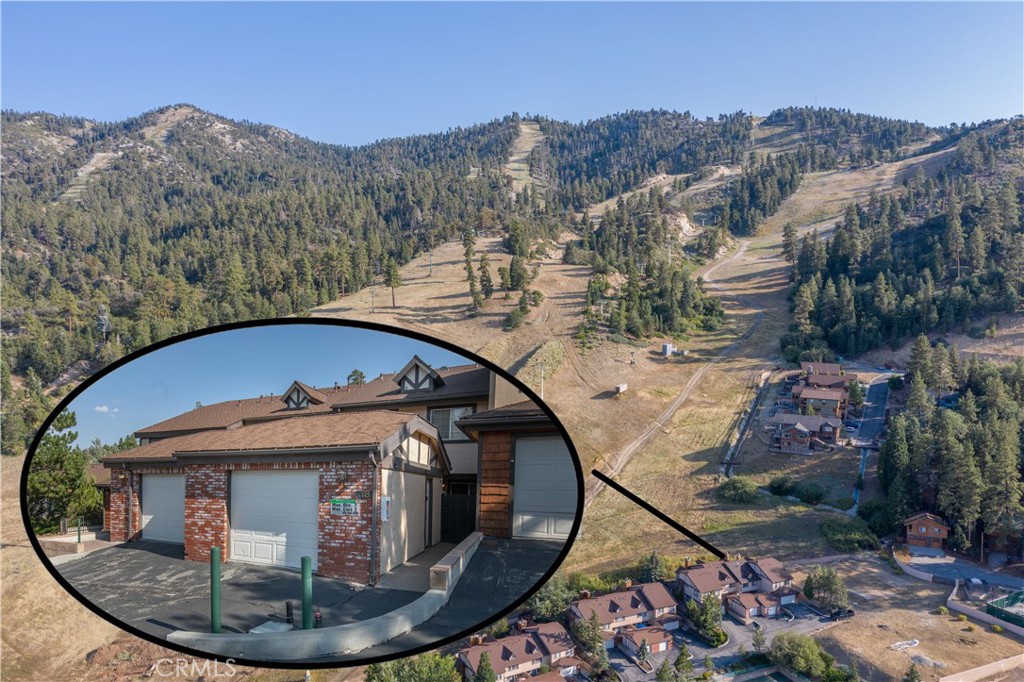 a view of a wooden house with a mountain view