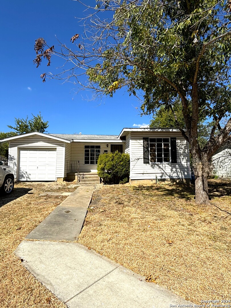 a front view of a house with a garage