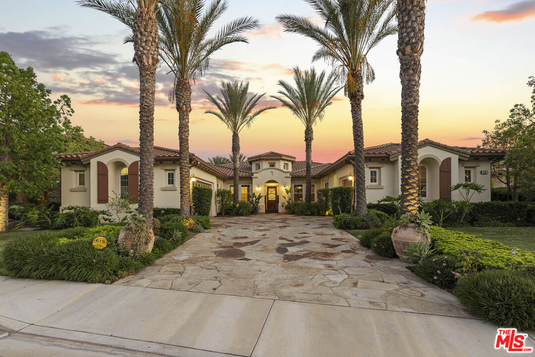 a view of a park with a house