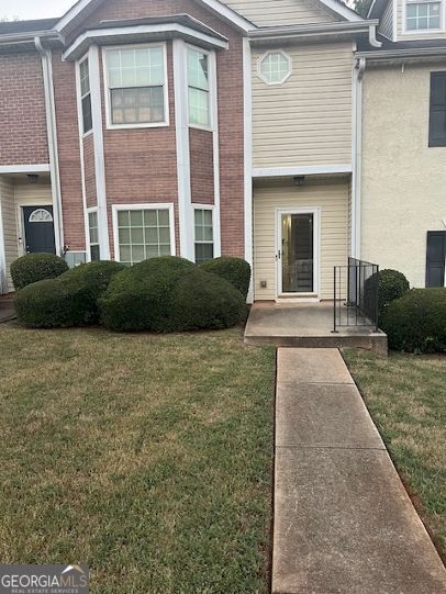 a front view of a house having yard