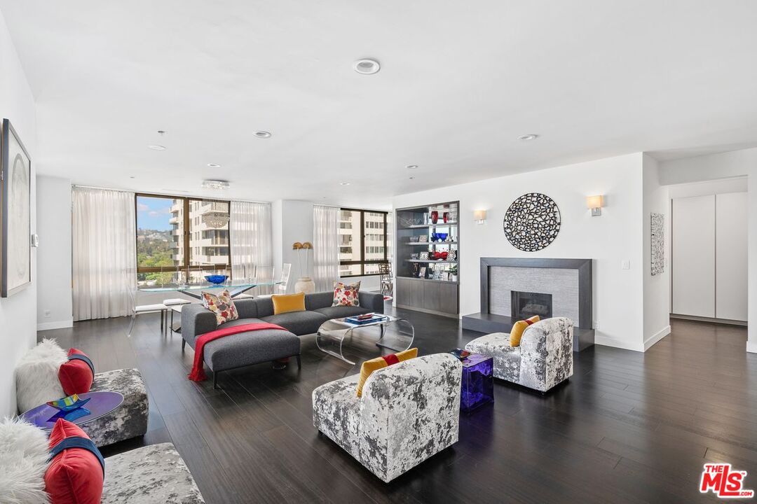 a living room with furniture couches and a fireplace