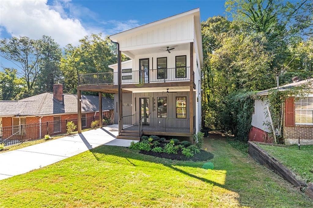 a view of a house with a yard patio and swimming pool