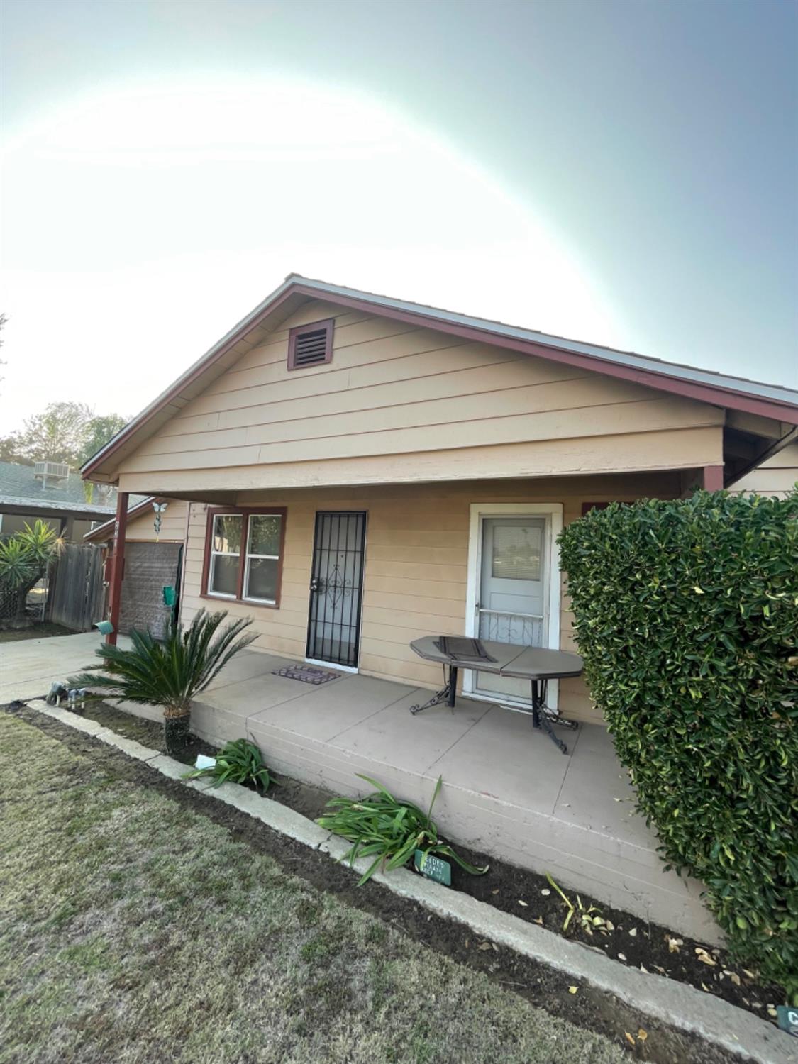 a front view of a house with garden