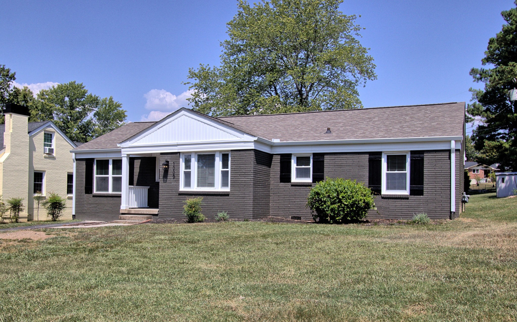 a front view of a house with a yard