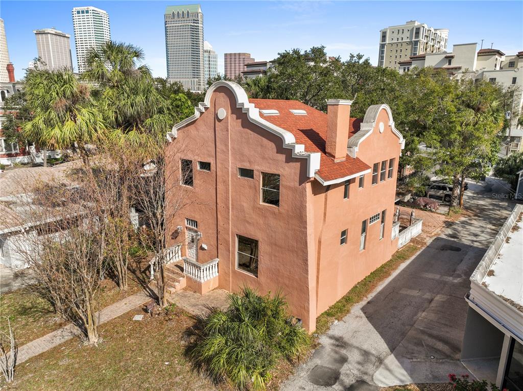 a aerial view of a house with a yard