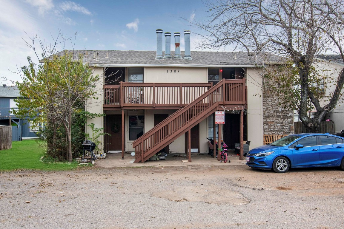 a view of a car park in front of house