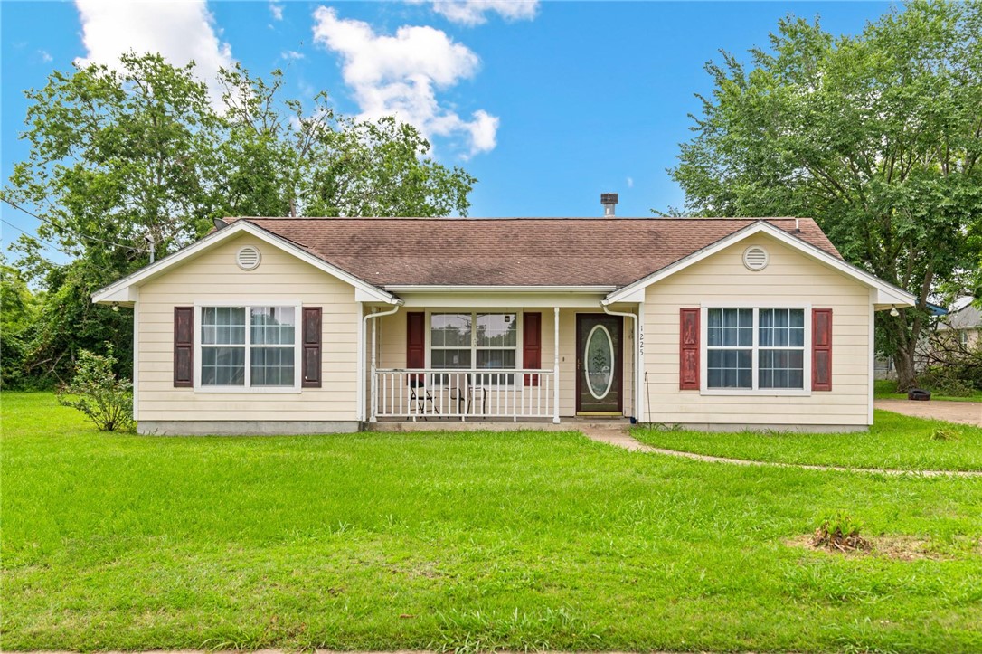 Single story home featuring covered porch and a fr