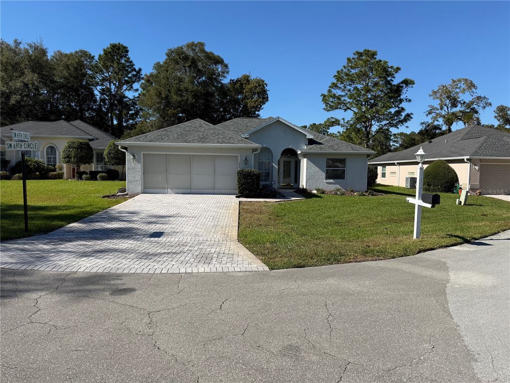 front view of a house with a yard