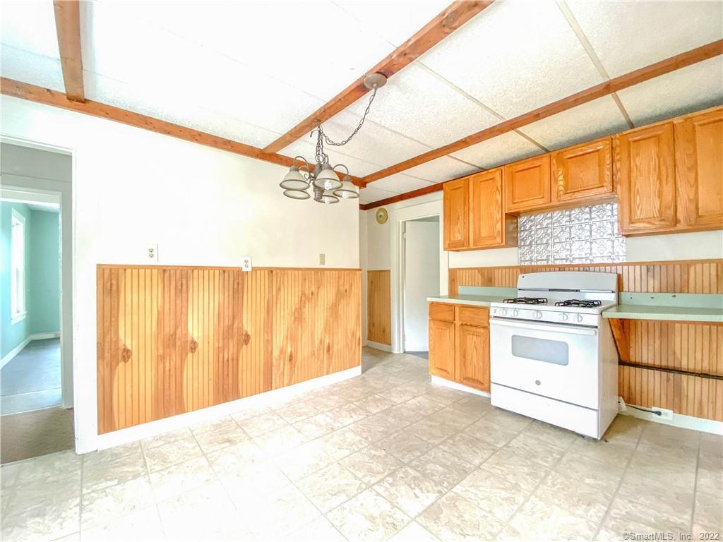 a kitchen with a stove a sink and a refrigerator