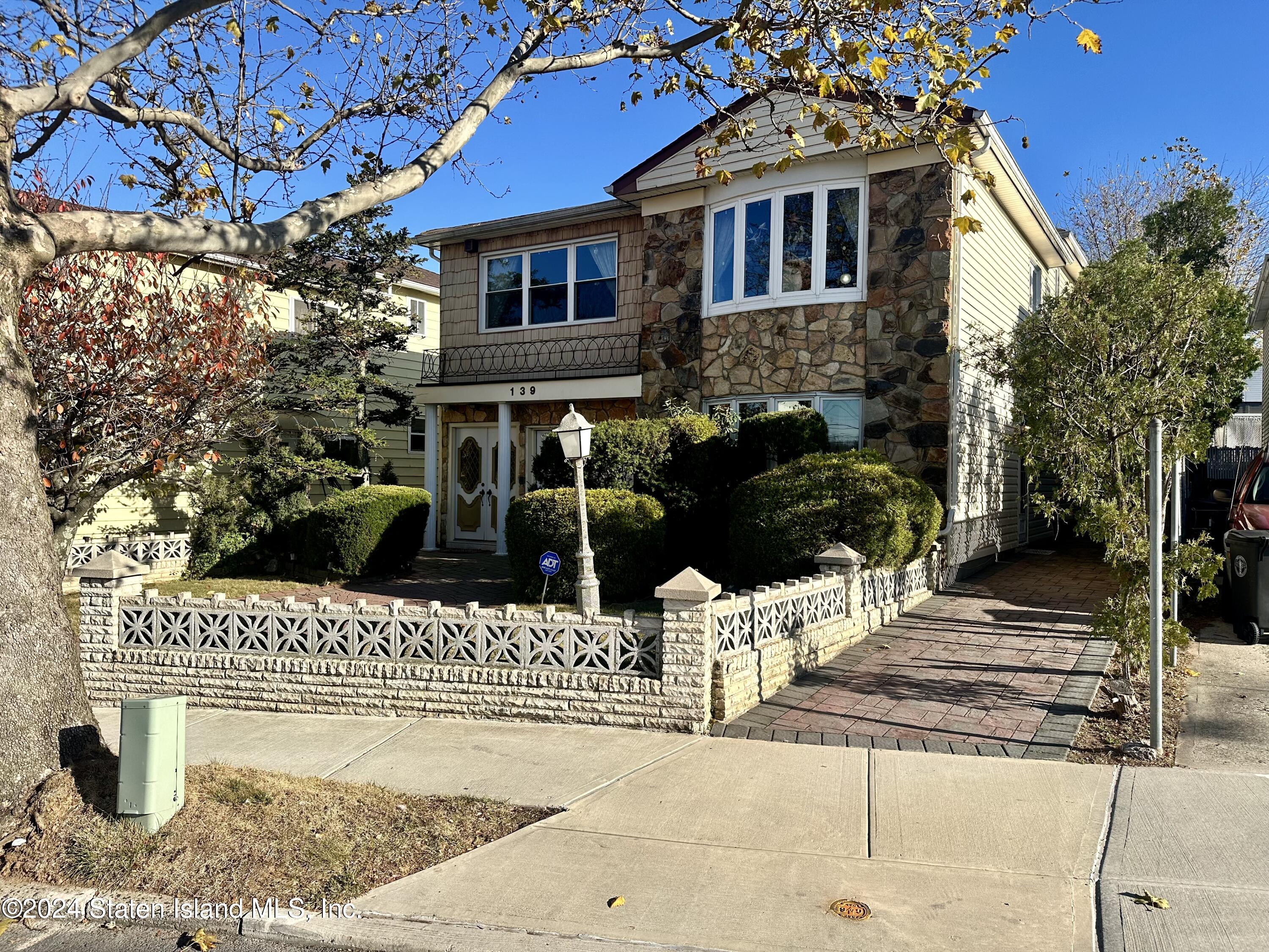 a front view of a house with street