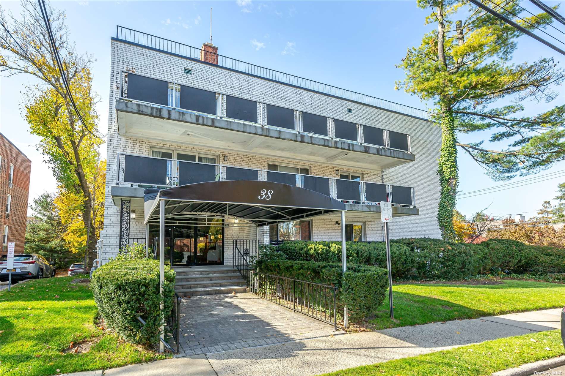 a front view of a building with garden