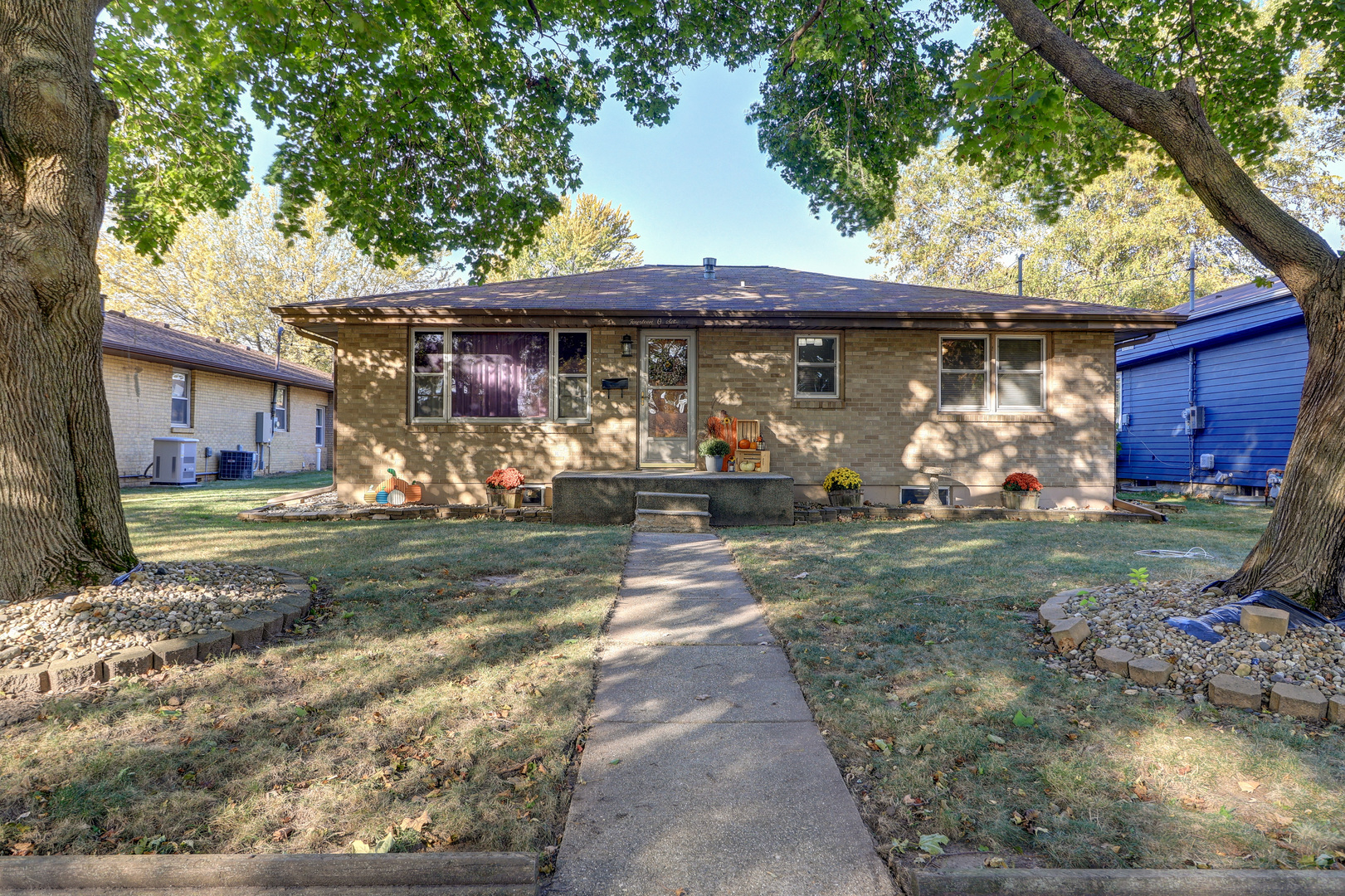 a front view of a house with garden