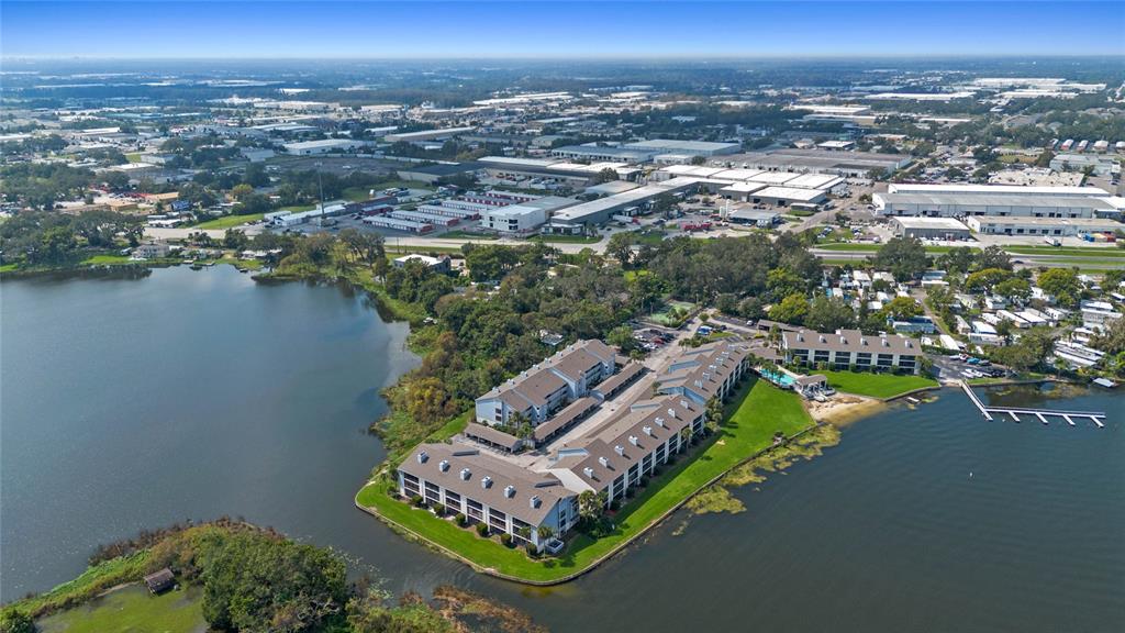 Aerial view of the point surrounded by water on all sides. Unit is 3rd floor second in from the right.