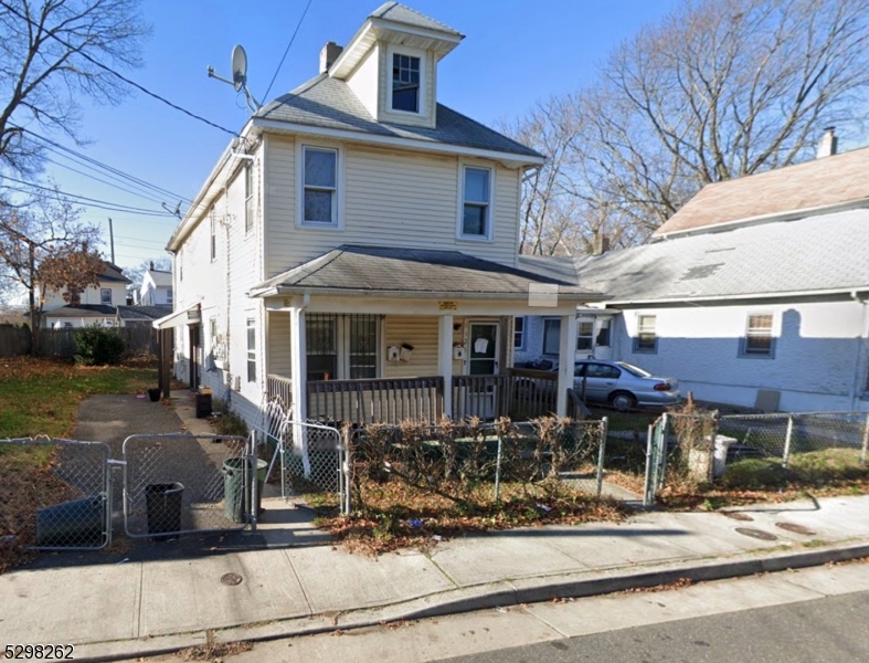 a view of a big house with street